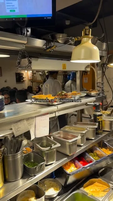 TestKitchen's open kitchen line with steel counters